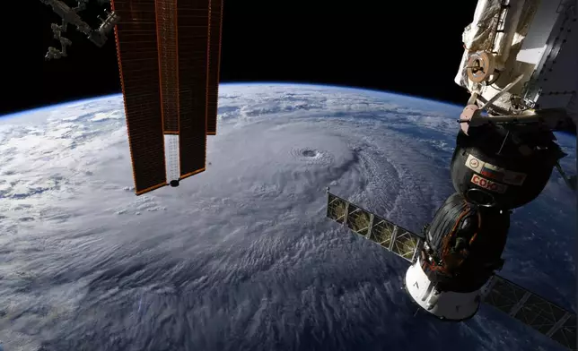 FILE - This image provided by NASA on Wednesday, Aug. 22, 2018 shows Hurricane Lane as seen from the International Space Station. (NASA via AP, File)