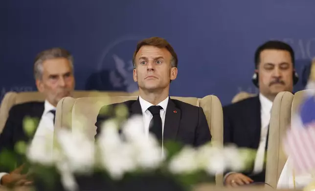 French President Emmanuel Macron looks on during the signature ceremony at the Gaza International Peace Summit, in Sharm el-Sheikh, Egypt, Monday, Oct.13 2025. (Yoan Valat, Pool photo via AP)