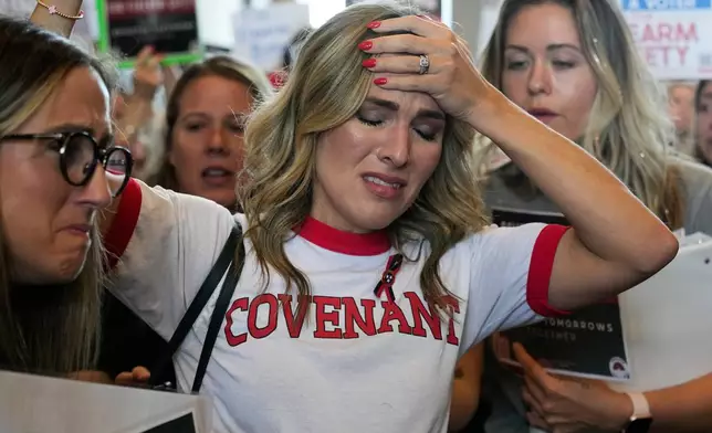 FILE - Covenant School parent Mary Joyce is overcome with emotion as she speaks outside the House chamber a special session of the state legislature on public safety adjourned, Aug. 29, 2023, in Nashville, Tenn. (AP Photo/George Walker IV, file)