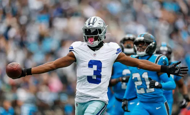 Dallas Cowboys wide receiver George Pickens (3) celebrates his touchdown catch in the second half of an NFL football game against the Carolina Panthers, Sunday, Oct. 12, 2025, in Charlotte, N.C. (AP Photo/Rusty Jones)