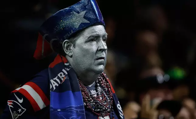 A New England Patriots fan reacts from the stands during the first half of an NFL football game against the New Orleans Saints, Sunday, Oct. 12, 2025, in New Orleans. (AP Photo/Butch Dill)