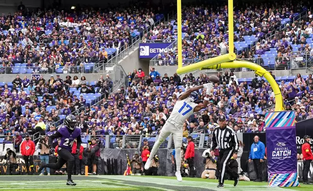 Los Angeles Rams wide receiver Davante Adams (17) attempts to make catch in the end zone as Baltimore Ravens safety Malaki Starks (24) covers during the first half of an NFL football game Sunday, Oct. 12, 2025, in Baltimore. (AP Photo/Stephanie Scarbrough)