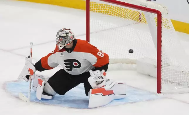 Florida Panthers center Anton Lundell scores a goal against Philadelphia Flyers goaltender Dan Vladar (80) during the second period of an NHL hockey game, Thursday, Oct. 9, 2025, in Sunrise, Fla. (AP Photo/Marta Lavandier)