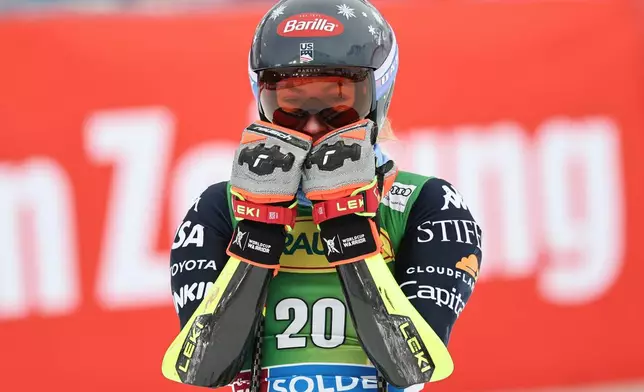 United States' Mikaela Shiffrin reacts at the finish area of an alpine ski, women's World Cup giant slalom, in Soelden, Austria, Saturday, Oct. 25, 2025. (AP Photo/Marco Trovati)