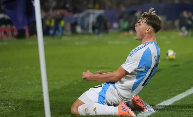 Argentina's Mateo Silvetti celebrates scoring his side's opening goal against Colombia during a FIFA U-20 World Cup semifinal soccer match at National Stadium in Santiago, Chile, Wednesday, Oct. 15, 2025. (AP Photo/Gustavo Garello)