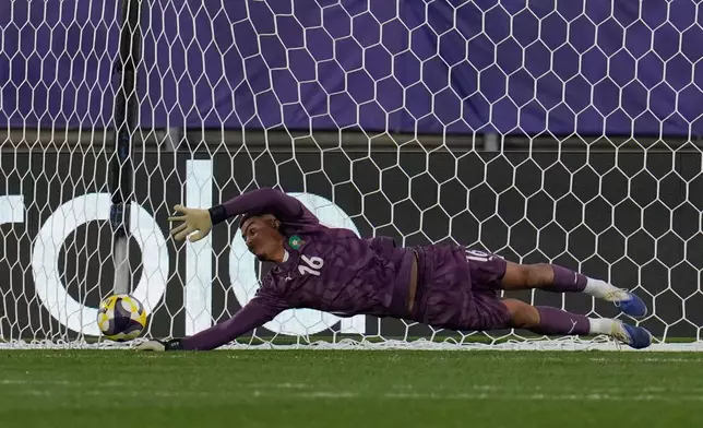 Morocco's goalkeeper Abdelhakim Mesbahi stops a penalty kick by France's Djylian Nguessan during a shootout in a FIFA U-20 World Cup semifinal soccer match at Elias Figueroa Brander Stadium in Valparaiso, Chile, Wednesday, Oct. 15, 2025 (AP Photo/Matias Delacroix)