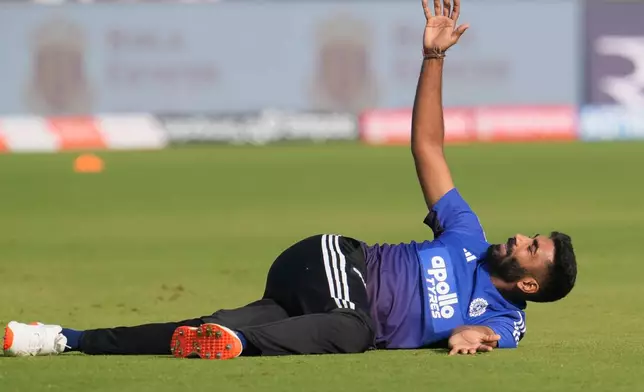 India's Jasprit Bumrah warms up before the start of the first day of the second cricket test match between India and West Indies at the Arun Jaitley Stadium in New Delhi, India, Friday, Oct.10, 2025. (AP Photo/Manish Swarup)