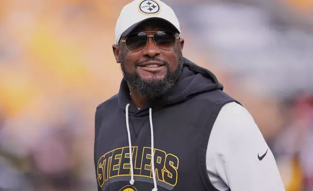 Pittsburgh Steelers head coach Mike Tomlin smiles before an NFL football game against the Cleveland Browns in Pittsburgh, Sunday, Oct. 12, 2025. (AP Photo/Gene J. Puskar)