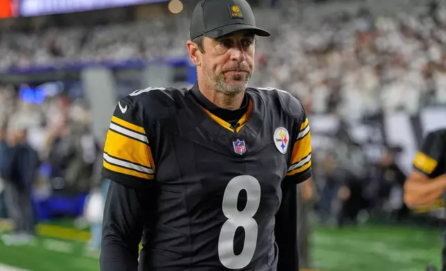 Pittsburgh Steelers quarterback Aaron Rodgers (8) walks off the field following an NFL football game against the Cincinnati Bengals in Cincinnati Thursday, Oct. 16, 2025. (AP Photo/Carolyn Kaster)