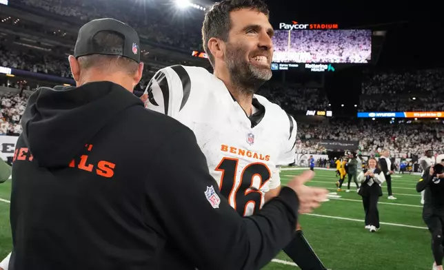 Cincinnati Bengals quarterback Joe Flacco, right, celebrates with head coach Zac Taylor after an NFL football game against the Pittsburgh Steelers in Cincinnati Thursday, Oct. 16, 2025. (AP Photo/Jeff Dean)