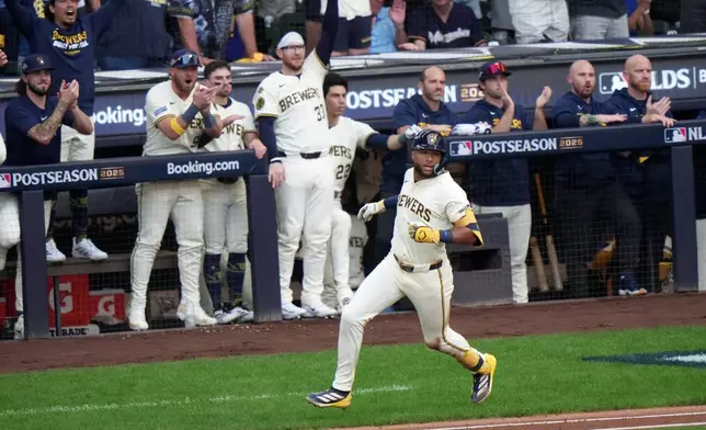 Milwaukee Brewers' Jackson Chourio hits a two-run scoring single during the first inning of Game 1 of baseball's National League Division Series against the Chicago Cubs Saturday, Oct. 4, 2025, in Milwaukee. (AP Photo/Morry Gash)