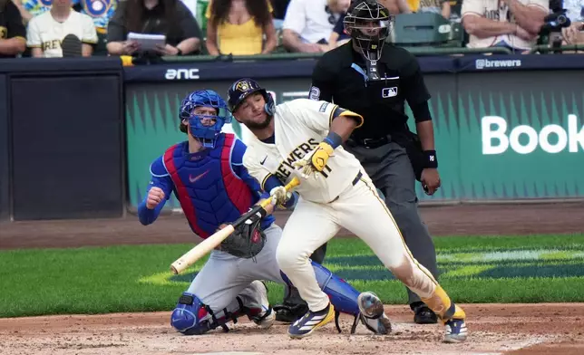 Milwaukee Brewers' Jackson Chourio hits an RBI single during the second inning of Game 1 of baseball's National League Division Series against the Chicago Cubs Saturday, Oct. 4, 2025, in Milwaukee. (AP Photo/Morry Gash)