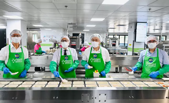 Guests tour the Food Angel Jockey Club Food Production Centre.