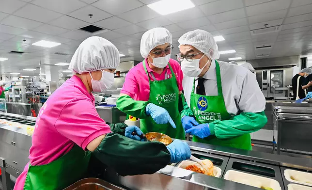 Guests tour the Food Angel Jockey Club Food Production Centre.