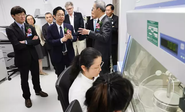 Guests tour The Hong Kong Jockey Club Global Health Institute global headquarters and laboratory.