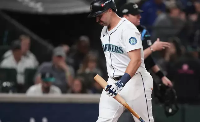 Seattle Mariners' Cal Raleigh reacts after popping out to Detroit Tigers third baseman Zach McKinstry during the 11th inning in Game 1 of baseball's American League Division Series, Saturday, Oct. 4, 2025, in Seattle. (AP Photo/Lindsey Wasson)