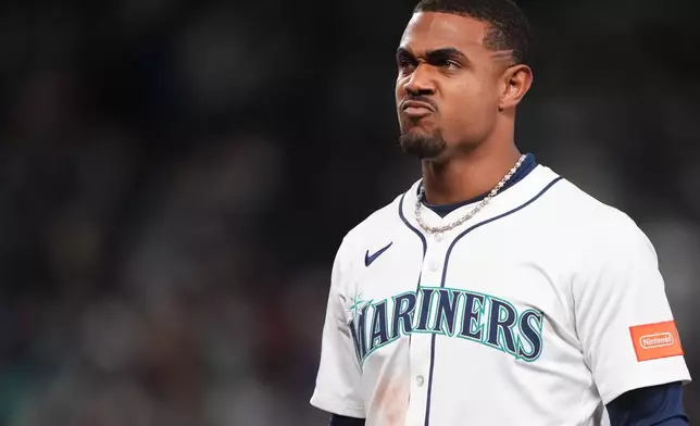 Seattle Mariners' Julio Rodriguez reacts after the team's loss in Game 1 of baseball's American League Division Series against the Detroit Tigers, Saturday, Oct. 4, 2025, in Seattle. (AP Photo/Lindsey Wasson)