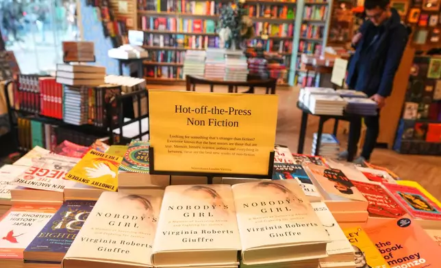 The memoir book of Virginia Giuffre, "Nobody's Girl" is seen in a book store and is up for sale in London, Tuesday, Oct. 21, 2025 six months after Giuffre died by suicide in April.(AP Photo/Kirsty Wigglesworth)