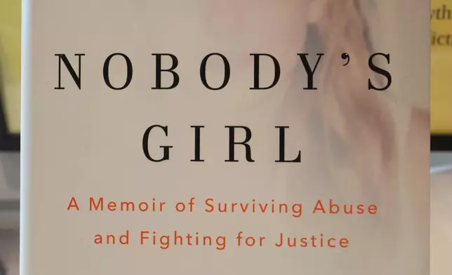 The memoir book of Virginia Giuffre, "Nobody's Girl" is seen in a book store and is up for sale in London, Tuesday, Oct. 21, 2025 six months after Giuffre died by suicide in April.(AP Photo/Kirsty Wigglesworth)