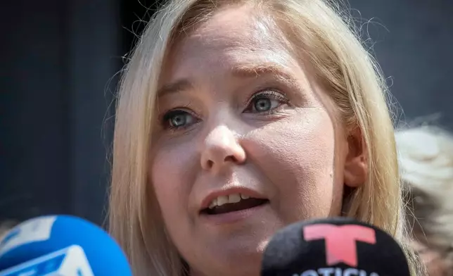 FILE - Virginia Roberts Giuffre speaks during a news conference outside a Manhattan court in New York, Aug. 27, 2019. (AP Photo/Bebeto Matthews, File)