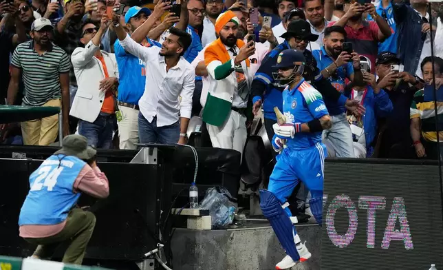 India's Virat Kohli runs out to bat against Australia during their One Day International cricket match in Sydney, Australia, Saturday, Oct. 25, 2025. (AP Photo/Rick Rycroft)