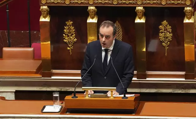 French Prime Minister Sebastien Lecornu delivers his policy speech at the National Assembly, Tuesday, Oct. 14, 2025 in Paris. (AP Photo/Thibault Camus)