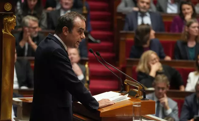 French Prime Minister Sebastien Lecornu delivers his policy speech at the National Assembly, Tuesday, Oct. 14, 2025 in Paris. (AP Photo/Thibault Camus)