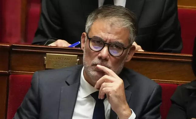 Secretary general of the French Socialist Party listens to French Prime Minister Sebastien Lecornu's policy speech at the National Assembly, Tuesday, Oct. 14, 2025 in Paris. (AP Photo/Thibault Camus)