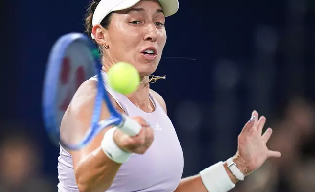 Jessica Pegula of the United States returns a shot to her compatriot Coco Gauff in the women's singles final at the WTA Wuhan Open in Wuhan in central China's Hubei province Sunday, Oct. 12, 2025. (Chinatopix Via AP)