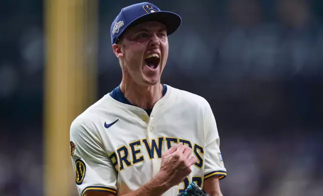 Milwaukee Brewers relief pitcher Jacob Misiorowski (32) celebrates after forcing the final out during the top of the third inning of Game 2 of baseball's National League Division Series against the Chicago Cubs Monday, Oct. 6, 2025, in Milwaukee. (AP Photo/Kayla Wolf)