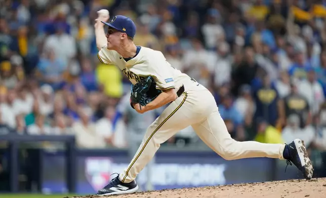 Milwaukee Brewers relief pitcher Jacob Misiorowski (32) delivers during the third inning of Game 2 of baseball's National League Division Series against the Chicago Cubs Monday, Oct. 6, 2025, in Milwaukee. (AP Photo/Kayla Wolf)