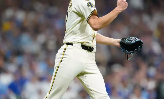 Milwaukee Brewers relief pitcher Jacob Misiorowski (32) gestures after striking out Chicago Cubs' Dansby Swanson (7) during the fourth inning of Game 2 of baseball's National League Division Series Monday, Oct. 6, 2025, in Milwaukee. (AP Photo/Kayla Wolf)