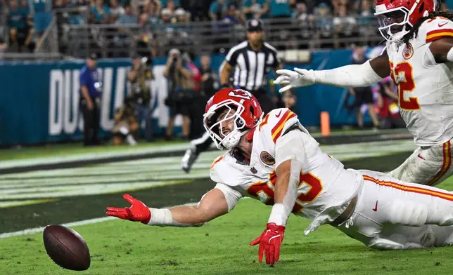Kansas City Chiefs linebacker Drue Tranquill (23) can't catch the ball for a interception during the first half of an NFL football game against the Jacksonville Jaguars, Monday, Oct. 6, 2025, in Jacksonville, Fla. (AP Photo/Phelan M. Ebenhack)