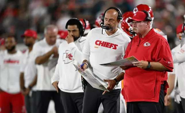 Kansas City Chiefs head coach Andy Reid and offensive coordinator Matt Nagy watch during the first half of an NFL football game against the Jacksonville Jaguars, Monday, Oct. 6, 2025, in Jacksonville, Fla. (AP Photo/Phelan M. Ebenhack)