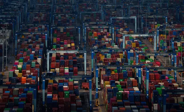 FILE - Shipping containers are stacked at Westport in Klang on the outskirts of Kuala Lumpur, Malaysia, April 18, 2025. (AP Photo/Vincent Thian, File)
