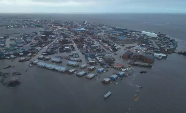 In this aerial photo provided by the Alaska Department of Transportation and Public Facilities, the city of Kotzebue, Alaska experiences flooding, Wednesday, Oct. 8, 2025. (Alaska Department of Transportation and Public Facilities via AP)