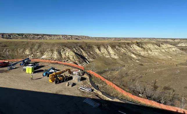 The view atop the roof of the Theodore Roosevelt Presidential Library shows the rugged Badlands landscape Tuesday, Oct. 7, 2025, near Medora, N.D. (AP Photo/Jack Dura)