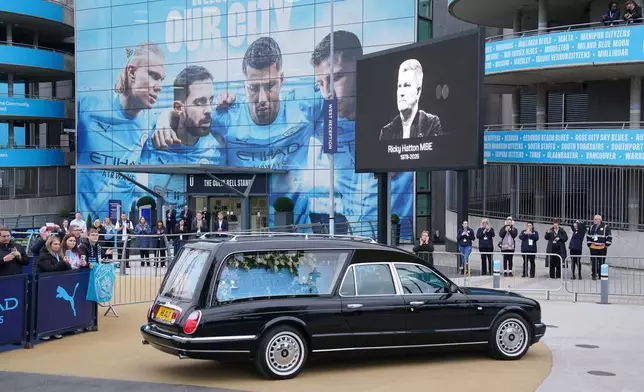 The hearse of former boxing champion , Ricky Hatton arrives at the Etihad Stadium following the funeral earlier at Manchester Cathedral, England, Friday Oct. 10, 2025. (Owen Humphreys/PA via AP)