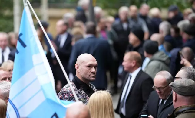 Boxer Tyson Fury, centre, attends the funeral of boxer Ricky Hatton, in Manchester, England, Friday, Oct. 10, 2025. (AP Photo/Jon Super)