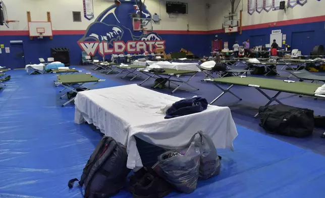 Beds and supplies sit at a sports center-turned-shelter ahead of Hurricane Imelda's expected arrival in Hamilton, Bermuda, Wednesday, Oct. 1, 2025. (AP Photo/Anthony Wade)