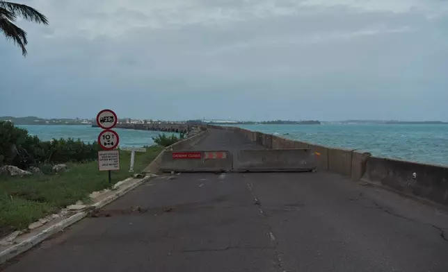 Cinderblocks restrict access to a cross-bay causeway ahead of Hurricane Imelda's expected arrival in Hamilton, Bermuda, Wednesday, Oct. 1, 2025. (AP Photo/Anthony Wade)