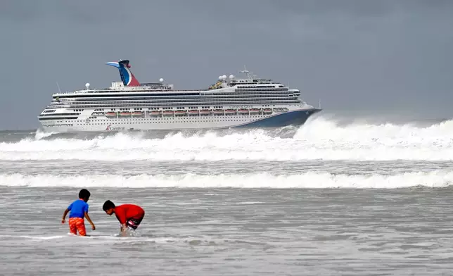 The Carnival Glory cruise ship sets sail as Tropical Storm Imelda passes offshore, Monday, Sept. 29, 2025, in Port Canaveral, Fla. (AP Photo/Phelan M. Ebenhack)