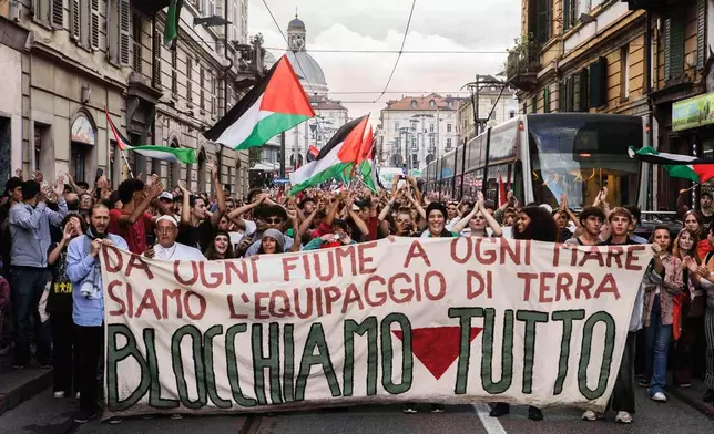 FILE - People protest during a nationwide transport, port, and school strike against the killing of Palestinians in Gaza, in Turin, Italy, on Sept. 22, 2025. (Andrea Alfano/LaPresse via AP, File)