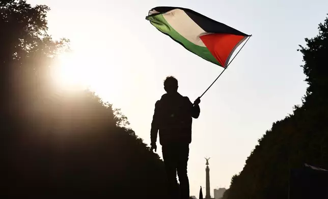 People protest against Israel during a mass demonstration called "All Eyes on Gaza" in support of Palestinians in Berlin, Germany, Saturday, Sept. 27, 2025. (AP Photo/Christoph Soeder)