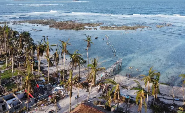 FILE -The remains of a damaged boardwalk caused by Typhoon Rai in Siargao island, Surigao del Norte, southern Philippines on, Dec. 22, 2021. (AP Photo/Alren Beronio, File)