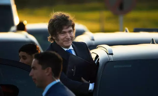 Argentina's President Javier Milei arrives at Ezeiza Prison Complex to present a draft reform of the criminal code to be sent to the Congress in Ezeiza, Argentina, Thursday, Oct. 2, 2025. (AP Photo/Rodrigo Abd)