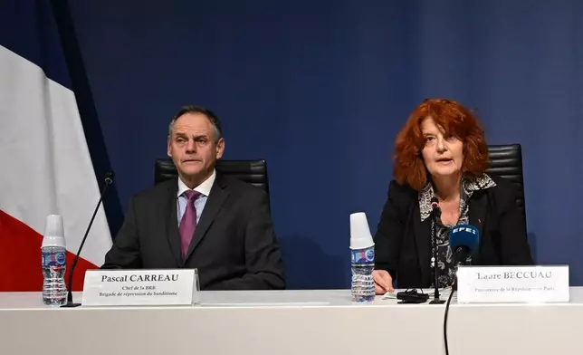 Head of the brigand of banditry repression Pascal Carreau, left, and Paris prosecutor Laure Beccuau speaks attend a news conference at the Paris courthouse Wednesday, Oct. 29, 2025, on the judicial investigation into the jewels robbery at the Louvre museum in Paris, France. (AP Photo/Emma Da Silva)
