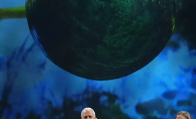 Pope Leo XIV, center, attends the International conference "Raising Hope for Climate Justice", in Castel Gandolfo, Italy, Wednesday, Oct. 1, 2025. (AP Photo/Alessandra Tarantino)