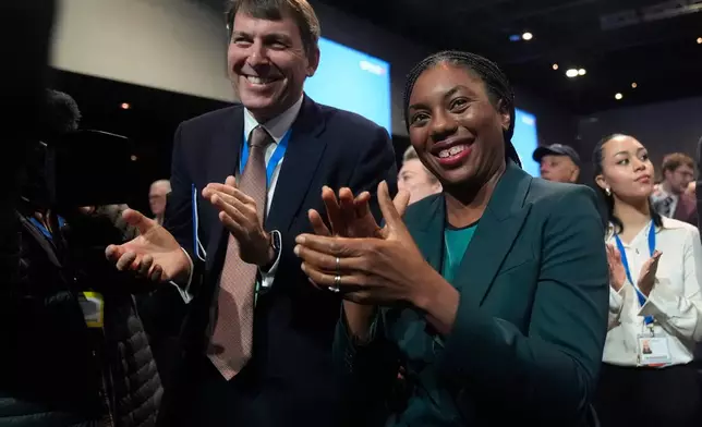 Party leader Kemi Bandenoch, front right, applauds after shadow chancellor Sir Mel Stride made his speech during the Conservative Party Conference in Manchester, England, Monday, Oct. 6, 2025. (Danny Lawson/PA via AP)