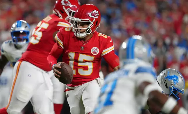 Kansas City Chiefs quarterback Patrick Mahomes (15) scrambles during the first half of an NFL football game against the Detroit Lions Sunday, Oct. 12, 2025, in Kansas City, Mo. (AP Photo/Ed Zurga)